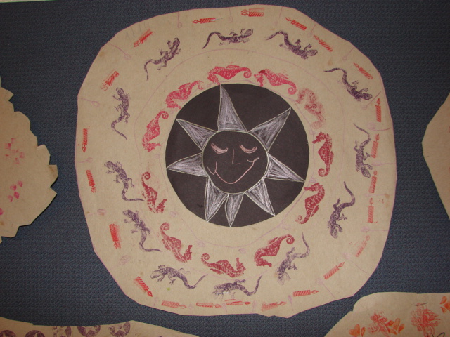 Picture 9 - sun with pattern of seahorses and lizards around it