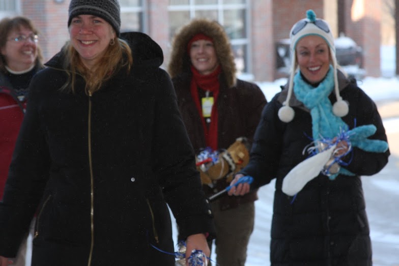 smiling teachers outside in the cold